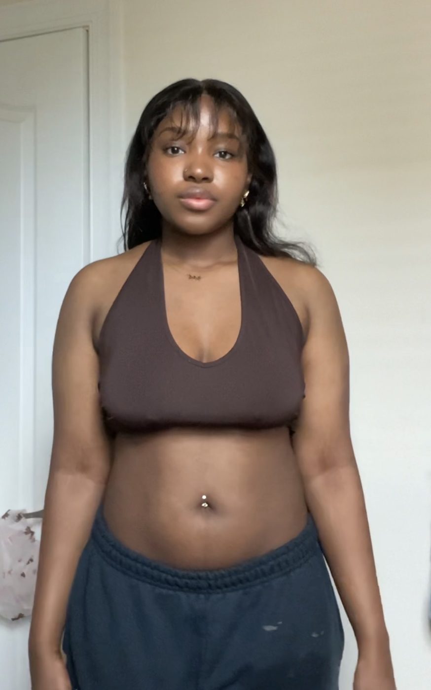 Grace before, standing facing the camera